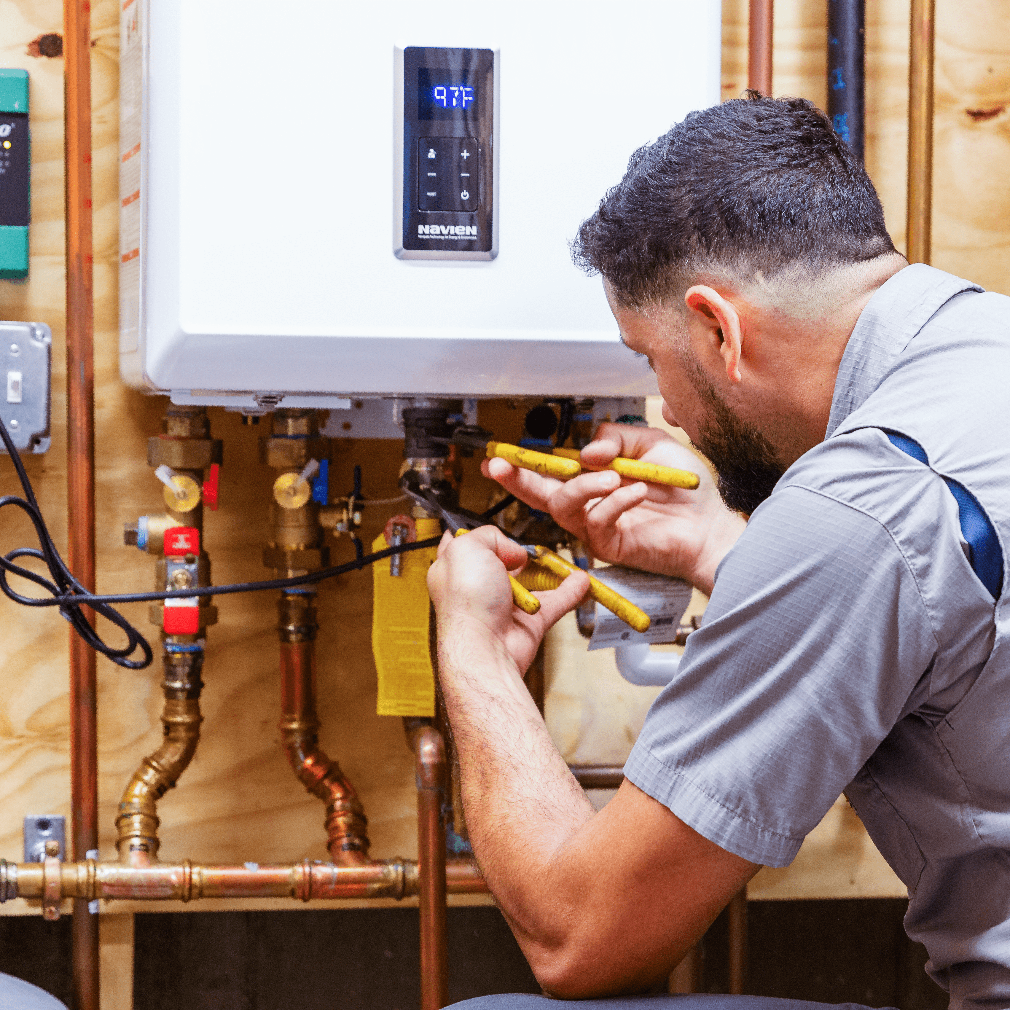 Technician working on a install water heater