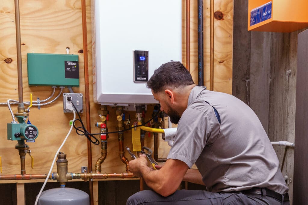 Fixing water Heater, replacing water heater and performing maintenance. Sharp Plumbing and Heating